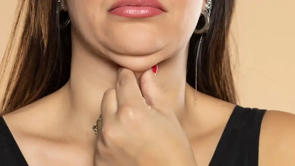 An image of a woman with double chin, sad, worried : Non Surgical Double Chin Removal Treatment in Ogden, UK